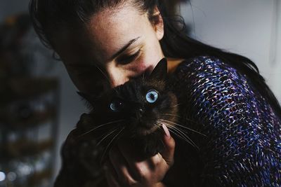 Portrait of woman with cat