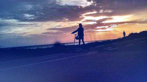 Silhouette of woman at sunset