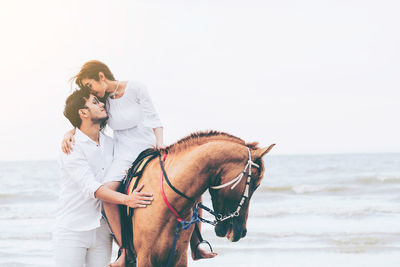 Female friends on sea shore