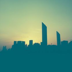 Low angle view of buildings at sunset