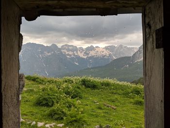 Scenic view of landscape and mountains against sky