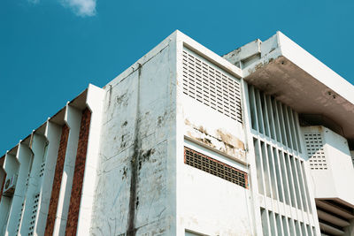 Low angle view of building against clear blue sky