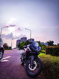 Bicycle parked on road against sky