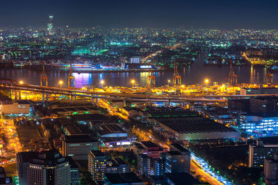 High angle view of illuminated buildings in city at night