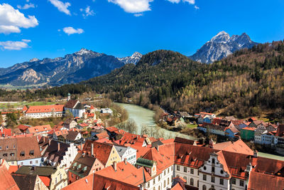 High angle view of townscape and mountains against sky