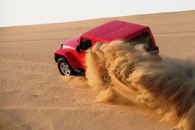 High angle view of off-road vehicle at desert