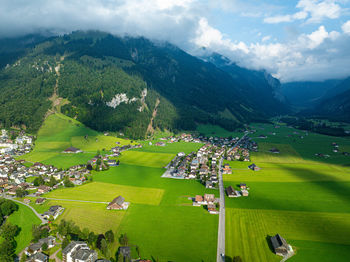 High angle view of townscape and mountains against sky