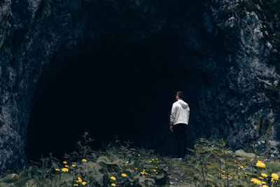 Rear view of man standing by tree