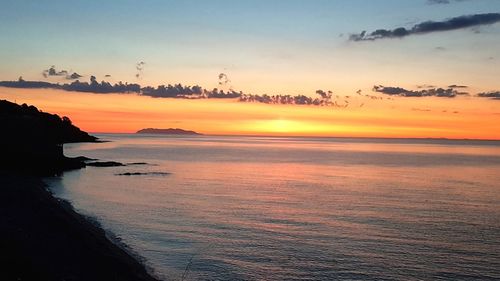 Scenic view of sea against sky during sunset