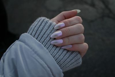 Close-up of woman hand showing nail polish