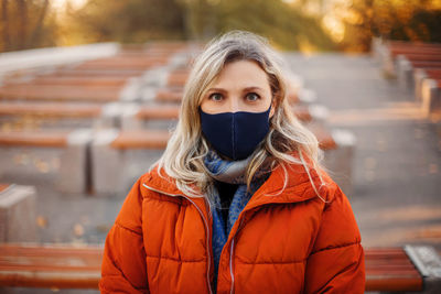 Portrait of young woman standing in winter