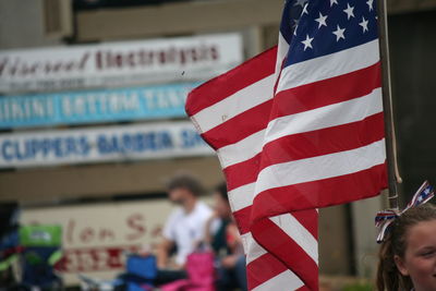 Girl with american flag during independence day parade