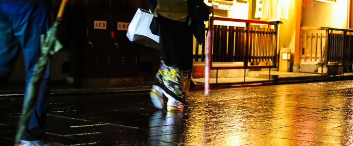 Low section of man in illuminated water