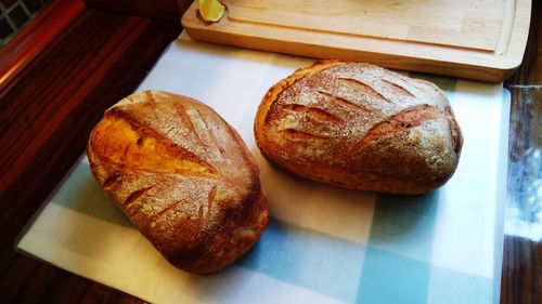 High angle view of bread on cutting board