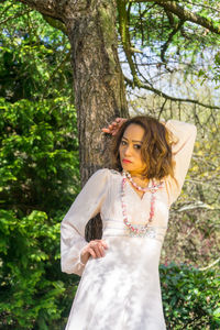 Portrait of young woman in forest