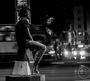 Man in city at night