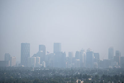 Downtown calgary alberta city skyline under smoke from forest fires
