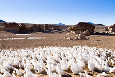 Panoramic view of rocks against clear sky