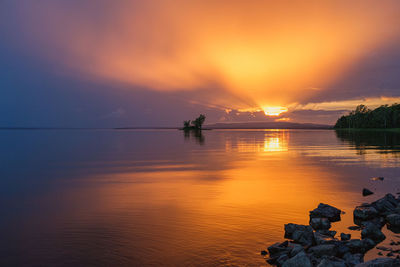 Scenic view of sea against orange sky