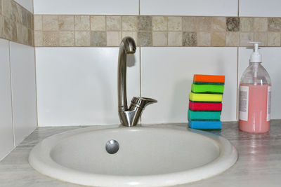 Close-up of faucet in bathroom at home