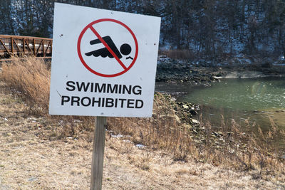 Close-up of warning sign on road