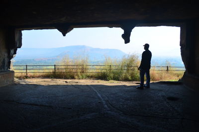 Rear view of man standing on landscape