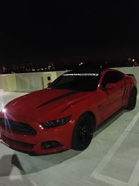 Red car at night