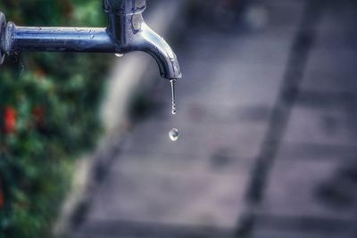 Close-up of water falling from faucet