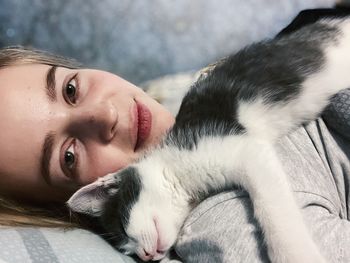 Portrait of woman with cat