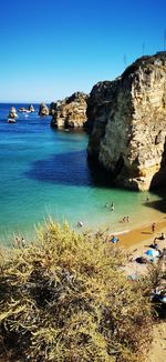 Scenic view of sea against clear blue sky