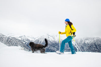 Man with dog in snow