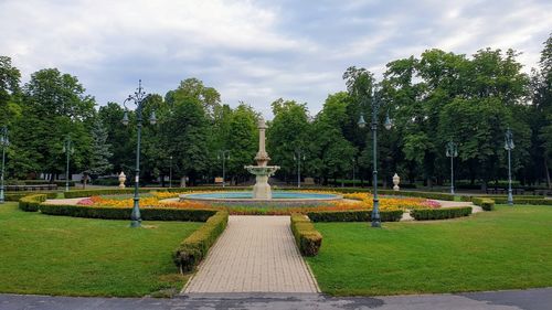 Fountain in park against sky