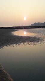 Scenic view of sea against sky at sunset