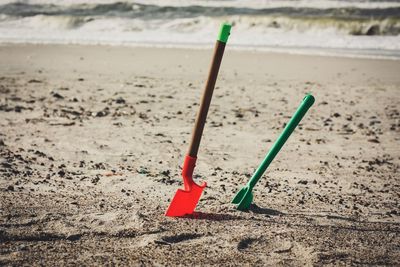 Close-up of toy on beach