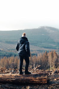 Rear view of man standing on land