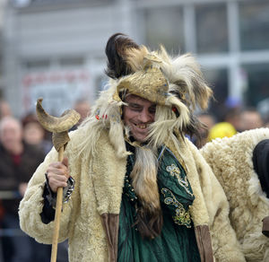 Close-up of man with horse standing outdoors