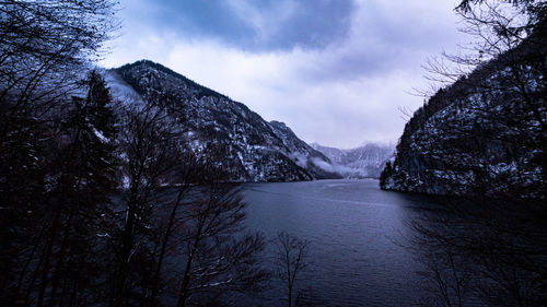 Scenic view of lake königssee amidst trees against sky