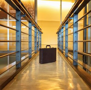 Suitcase on corridor at subway station