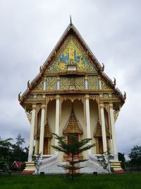 Facade of stupa against sky