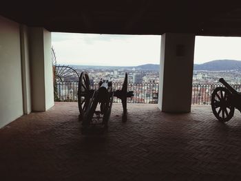 People on table against sky in city