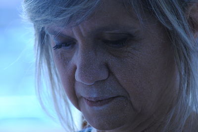 Close-up of mature woman looking down