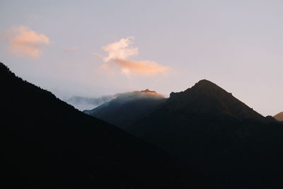 Scenic view of silhouette mountains against sky