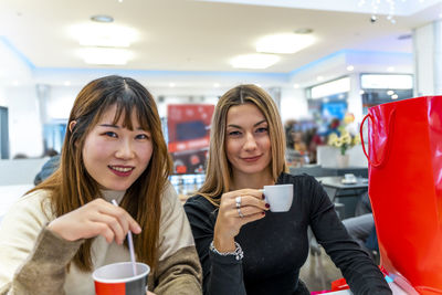 Portrait of young woman using mobile phone