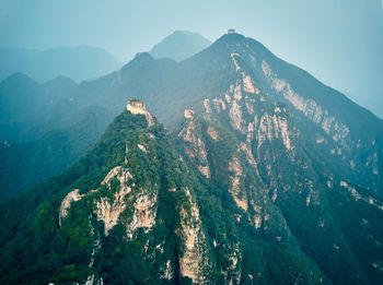 Scenic view of mountains against cloudy sky