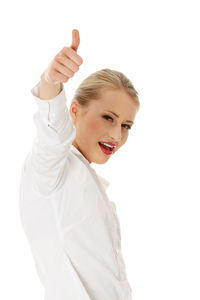 Portrait of a smiling young woman over white background
