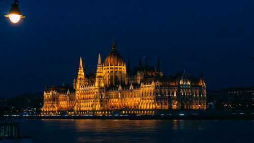 Illuminated building lit up at night