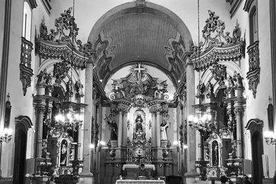 Statue in illuminated cathedral