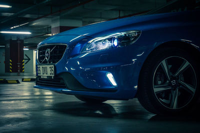 Car parked in parking lot at night