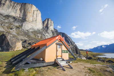 Backpacker stands outside of the north pangnirtung emergency shelter