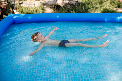 Man swimming in pool